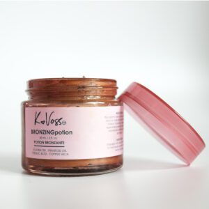 Open jar of Kalaya hydrating face cream with pink lid.